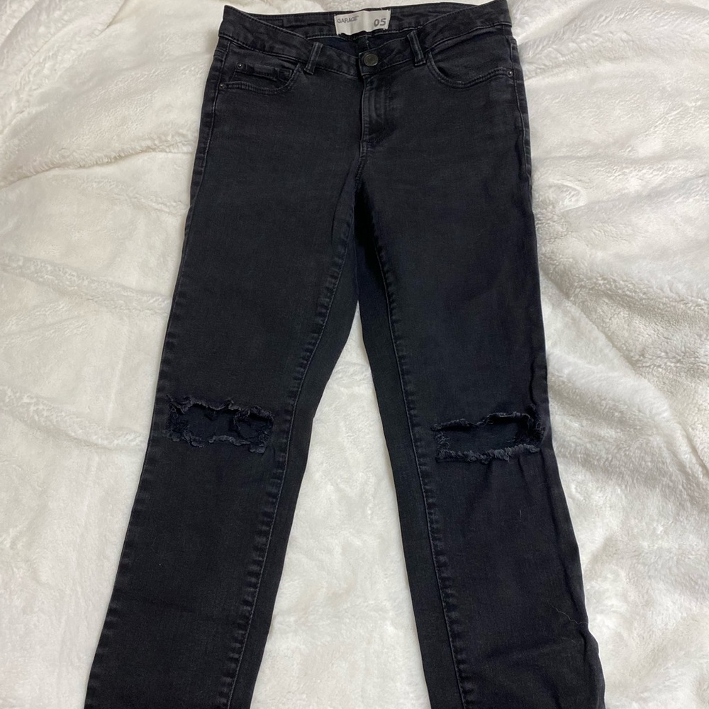 Black knee ripped jeans